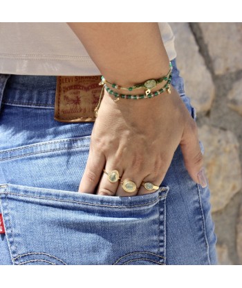 Bague dorée pierre ovale contour texturé Les magasins à Paris