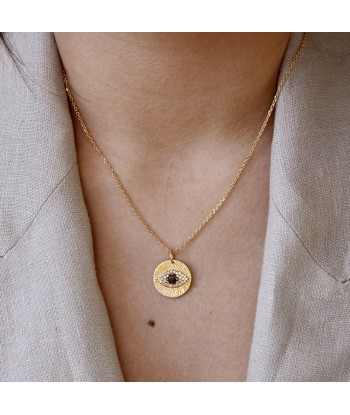 Collier doré médaille oeil et zircons une grave pollution 